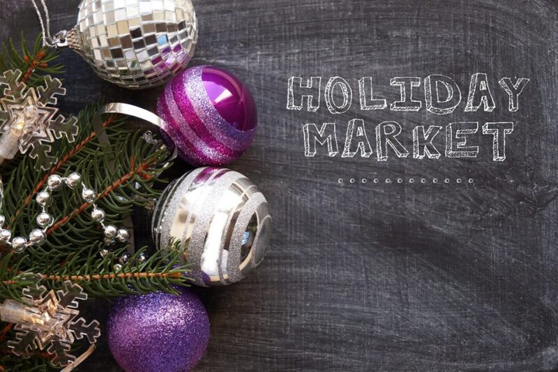purple and white christmas ball ornaments on the right on the left "Holiday Market"