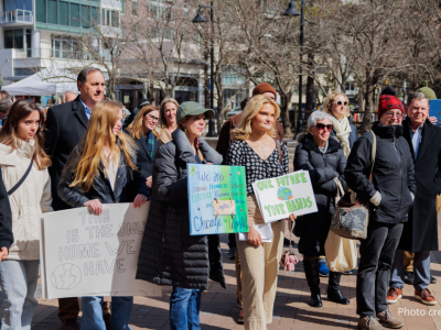 2025-Climate Resolution-3 photo of crowd at the 2/22/25 Climate Resolution Rally holding signs and listening attentively. Photo credit: @elmanstudio