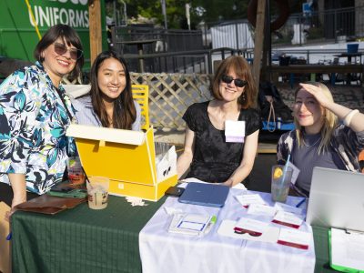 EcoAction Staff and volunteers greet guests at checkin