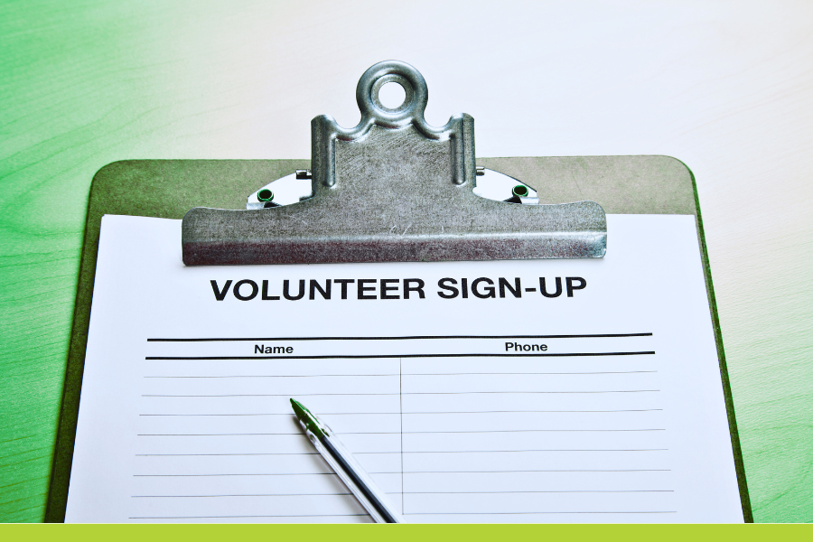 photo of a clipboard with a sheet of paper with the header Volunteer Signup