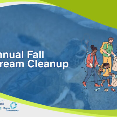 Family members walking along a trail while collecting litter into bags and bins, with scattered trash on the ground International Coastal Cleanup logo with a blue bird silhouette and wave-like lines above the text “International Coastal Cleanup” in blue. Ocean Conservancy logo with a blue circular wave emblem and the text “Ocean Conservancy” in dark blue, with small blue splashes around the emblem.