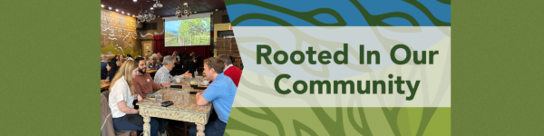 banner graphic with dark green background for a luncheon at Busboys & Poets Shirlington on Thursday, February 11, 2027 on the right is green and blue abstract leaf-like background with the bold text “Rooted In Our Community” centered across the image. On the right a photo of people sitting at tables with plates and glasses in front of them, with a colorful illuminated screen in the background depicting trees.