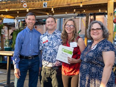 John Bloom, an executive committee member of the Potomac River Group of the Sierra Club, Levi Novey, EcoAction Arlington Board Chair, Mary Kadera, 2026 Impact Award recipient, and Elenor Hodges, EcoAction Arlington Executive Director